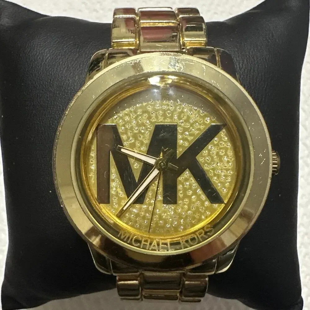 Michael Kors-3113 Woman’s Gold Tone Watch w/new Battery 100 Meters tested works - Picture 1 of 12